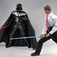 Illustration for article titled Barack Obama Doll Relaxes With Miniature Famicom
